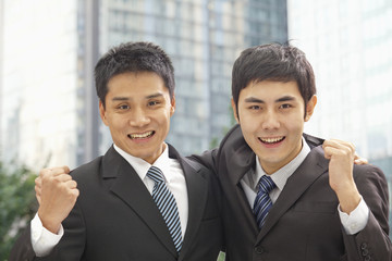 Portrait of Two Businessmen Cheering