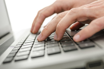 Businessman hands typing on laptop keyboard