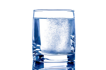 Two tablet in glass of water