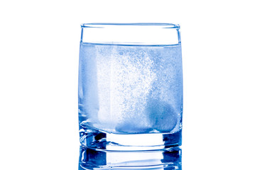 Two tablet in glass of water