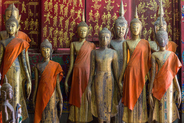 A group of buddha statues (standing)