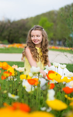 Obraz na płótnie Canvas Girl with beautiful colorful poppies