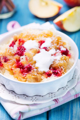 Rice pudding with applem raspberry and cinnamon - obrazy, fototapety, plakaty
