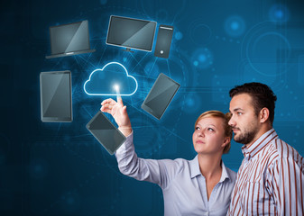 Happy couple touching cloud service