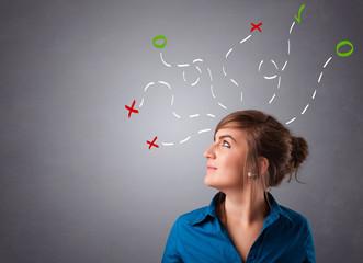 Young woman thinking with abstract marks overhead