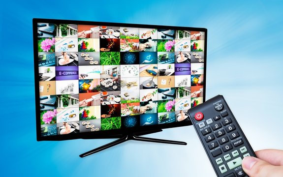 TV with multiple images gallery on blue background. Hand hold re
