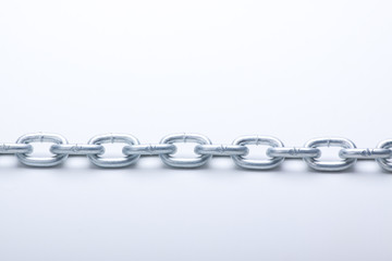 metal links of chain on a white background