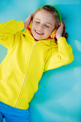 Young girl with headphones enjoying music