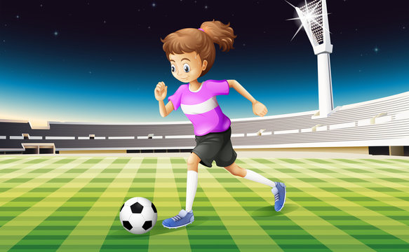 A girl at the field playing football