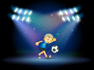 Fototapeta premium A young football player at the stage