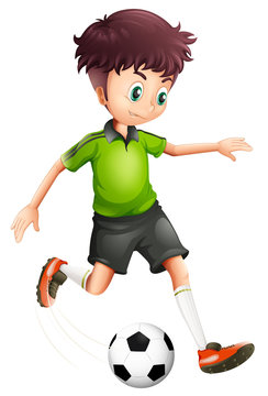 A boy with a green shirt playing soccer