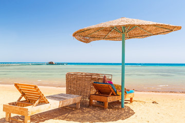 Relax under parasol on the beach of Red Sea, Egypt