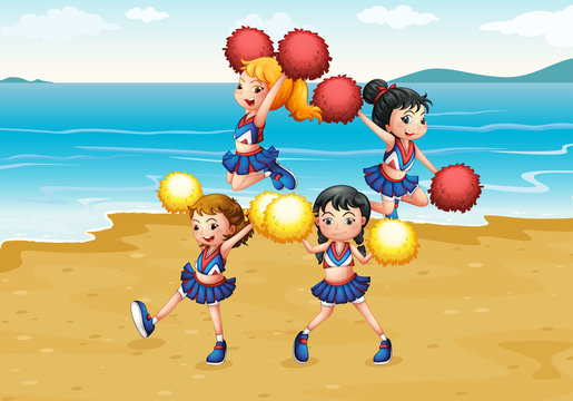 A cheering squad performing at the beach