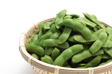 Green soybeans in the pod on white background