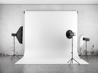 Empty photo studio with lighting equipment