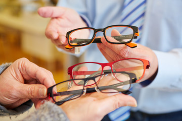 Optician offering choice of glasses