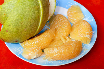 Grapefruit slices on the plate.