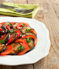 Roasted eggplants with fresh tomatoes and garlic