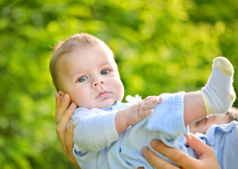 Little boy in a father`s hand