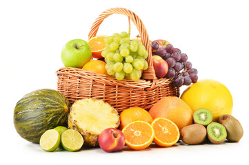 Variety of fruits in wicker basket isolated on white