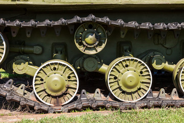 Fototapeta na wymiar Caterpillars of the old soviet tank