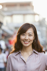 Obraz premium Portrait Of Smiling Mid Adult Woman In Houhai, Beijing