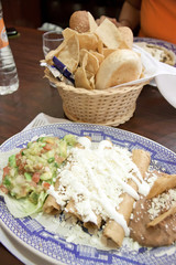 Enchiladas with cheese and beans.
