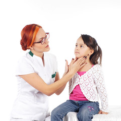 Attractive young doctor and the little girl isolated on white