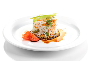 Delicious risotto with vegetables, isolated on white