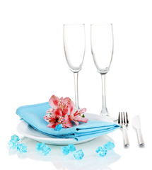 Festive table setting with flowers isolated on white