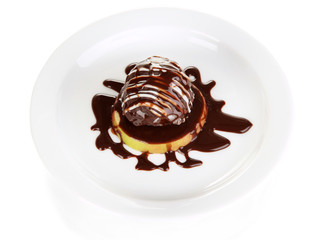 Chocolate dessert on big plate isolated on white