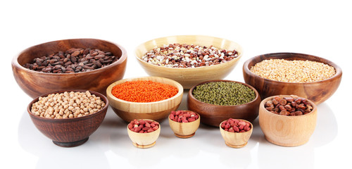 Different kinds of beans in bowls isolated on white