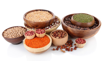 Different kinds of beans in bowls isolated on white