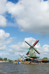 Fototapeta na wymiar Windmills at Dutch Zaanse Schans
