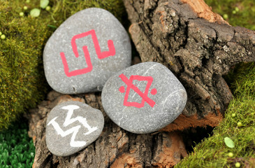Fortune telling  with symbols on stone close up