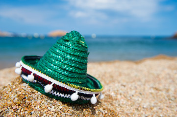Green Spanish straw hat at beach