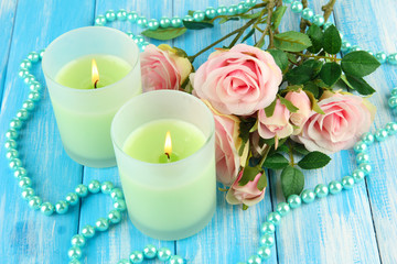 Candles on wooden table close-up