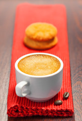 Coffee cup and cookies on a table