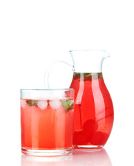 Cherry drink in pitcher and glass isolated on white.
