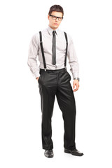 Full length portrait of a young stylish man looking at camera