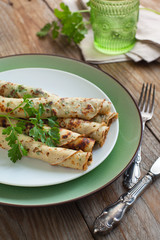 Rolled crepes with fresh herbs