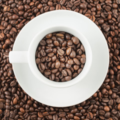 Cup full of coffee beans