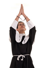 young man with handcuffs costumed in nun for fun, funny religiou