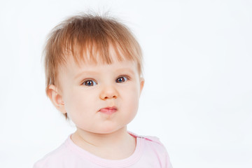 Fototapeta premium Portrait of funny baby, on a gray background