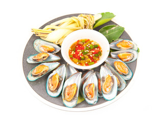 pile of cooked mussels over white background