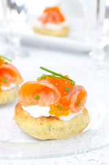 appetizer - potato bun with salted salmon, red caviar closeup