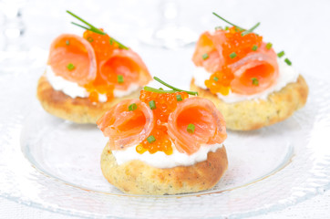 appetizer - potato bun with salmon, red caviar, green onions