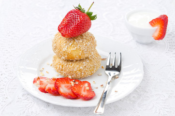 cheese pancakes with fresh strawberries and yogurt