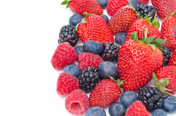 Close-up of assorted fresh berries isolated on a white