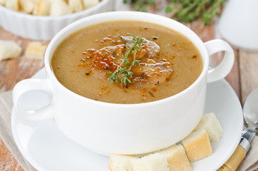 mushroom soup with thyme and croutons horizontal close-up
